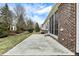 Cement patio with brick exterior leading to the screened-in porch at 15745 Market Center Dr, Carmel, IN 46033
