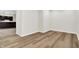 Partially finished basement with wet bar, light hardwood-style flooring, and neutral walls at 15745 Market Center Dr, Carmel, IN 46033