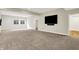 Spacious finished basement with neutral carpet, recessed lighting, and a large window at 15745 Market Center Dr, Carmel, IN 46033