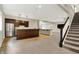 Finished basement with a kitchen and stairs, offering a great entertaining space at 15745 Market Center Dr, Carmel, IN 46033