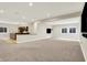 Open basement featuring neutral carpet, recessed lighting, and a kitchen area for entertaining at 15745 Market Center Dr, Carmel, IN 46033