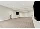 Large finished basement with recessed lighting, neutral carpet, and access to other rooms at 15745 Market Center Dr, Carmel, IN 46033