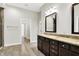 Bathroom with a granite countertop vanity and a doorway into a separate room at 15745 Market Center Dr, Carmel, IN 46033