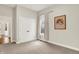 Neutral bedroom with a window with curtains and a double door closet, ready for personalization at 15745 Market Center Dr, Carmel, IN 46033
