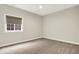 Comfortable bedroom with carpet flooring and a window dressed with shades for privacy at 15745 Market Center Dr, Carmel, IN 46033