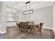 Dining room featuring a modern light fixture and large table with seating for eight at 15745 Market Center Dr, Carmel, IN 46033