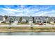 A picturesque street view featuring attractive homes with manicured lawns near a tranquil waterway at 15745 Market Center Dr, Carmel, IN 46033