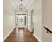 Home foyer with hardwood floors, high ceilings, and modern lighting fixtures at 15745 Market Center Dr, Carmel, IN 46033