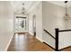 Elegant home foyer with hardwood floors, high ceilings, and modern lighting fixtures at 15745 Market Center Dr, Carmel, IN 46033