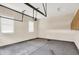 Spacious garage with bright lighting and windows at 15745 Market Center Dr, Carmel, IN 46033
