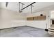 Bright garage with access door to the house and overhead storage at 15745 Market Center Dr, Carmel, IN 46033