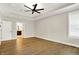 This main bedroom features wood floors, tray ceiling, ceiling fan and en-suite bathroom at 15745 Market Center Dr, Carmel, IN 46033