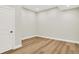 Room with hardwood floors, white trim, and recessed lighting, with a door leading out at 15745 Market Center Dr, Carmel, IN 46033