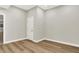Room showcasing hardwood floors, neutral walls, and white trim with ample natural light at 15745 Market Center Dr, Carmel, IN 46033