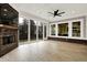 Bright sunroom with a fireplace, large windows offering natural light and neutral tiling at 15745 Market Center Dr, Carmel, IN 46033