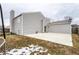 A spacious backyard featuring a concrete patio, ideal for outdoor entertaining at 163 Country Wood Dr, Whiteland, IN 46184
