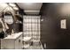 Charming bathroom with modern fixtures, vanity with sink, and black and white color accent at 163 Country Wood Dr, Whiteland, IN 46184