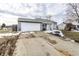 Attractive one-story home with a two-car garage on a cloudy day at 163 Country Wood Dr, Whiteland, IN 46184