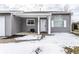 Inviting front porch with snow, and white door, creating a welcoming entrance at 163 Country Wood Dr, Whiteland, IN 46184