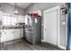 Bright kitchen featuring white cabinets, stainless steel appliances, and modern gray walls at 163 Country Wood Dr, Whiteland, IN 46184