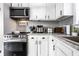 Beautiful kitchen featuring stainless steel appliances, white cabinets, and modern countertops at 163 Country Wood Dr, Whiteland, IN 46184