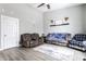 Inviting living room with cozy furniture, a ceiling fan, and a bright, airy feel at 163 Country Wood Dr, Whiteland, IN 46184