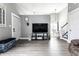Spacious open-concept living room with modern decor and hardwood flooring at 163 Country Wood Dr, Whiteland, IN 46184