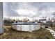 Above-ground pool situated in a fenced backyard with shed and trampoline at 163 Country Wood Dr, Whiteland, IN 46184
