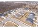 Aerial view of a residential neighborhood featuring modern homes with manicured lawns in a peaceful setting at 16401 Brigham Ln, Westfield, IN 46074