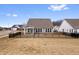 Backyard featuring lush grass and a black fence, offering privacy and security at 16401 Brigham Ln, Westfield, IN 46074