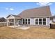Beautiful backyard with a covered patio and lush grass, perfect for outdoor living and entertaining at 16401 Brigham Ln, Westfield, IN 46074