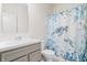 Neutral bathroom with a sink and a toilet, shower curtain in bright shades of blue at 16401 Brigham Ln, Westfield, IN 46074