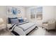Comfortable bedroom with a large window, soft lighting, and a well-coordinated bedding set at 16401 Brigham Ln, Westfield, IN 46074