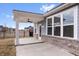 Inviting covered patio with brick and a ceiling fan, perfect for enjoying the outdoors at 16401 Brigham Ln, Westfield, IN 46074