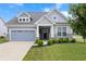 Charming single Gathering home with a well-maintained lawn and a two-car garage at 16401 Brigham Ln, Westfield, IN 46074