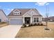 Charming single-Gathering home showcasing a well-manicured lawn, neutral color palette and an attached garage at 16401 Brigham Ln, Westfield, IN 46074