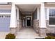 Inviting front porch featuring stone supports, neutral siding and a covered entry at 16401 Brigham Ln, Westfield, IN 46074