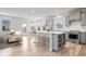Bright, open kitchen with a large island, stainless steel appliances, and modern gray cabinetry at 16401 Brigham Ln, Westfield, IN 46074