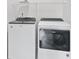 Well-equipped laundry area featuring Whirlpool washer and dryer set, ensuring efficient laundry care at 16401 Brigham Ln, Westfield, IN 46074