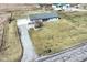 Aerial view of a cute home with a long driveway and a sprawling front yard and backyard at 22569 State Road 37 N, Noblesville, IN 46060