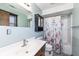 Fresh bathroom featuring a vanity, mirror, and tub-shower combo with a floral curtain at 22569 State Road 37 N, Noblesville, IN 46060