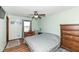 Relaxing bedroom features wood floors, a ceiling fan, and neutral tones at 22569 State Road 37 N, Noblesville, IN 46060