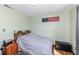 Bedroom featuring wood floors and trim, with a light green color scheme at 22569 State Road 37 N, Noblesville, IN 46060