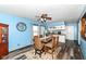 Dining room with a modern light fixture, and view into the kitchen at 22569 State Road 37 N, Noblesville, IN 46060