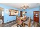 Inviting dining area with a wooden table, and view into the living room at 22569 State Road 37 N, Noblesville, IN 46060