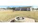 A backyard fire pit surrounded by brick pavers, perfect for cozy gatherings and outdoor relaxation at 22569 State Road 37 N, Noblesville, IN 46060