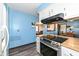 Bright eat-in kitchen features a stainless steel oven, cooktop, and white cabinets at 22569 State Road 37 N, Noblesville, IN 46060