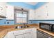 Charming kitchen featuring white cabinets, wood countertops and an undermount sink at 22569 State Road 37 N, Noblesville, IN 46060