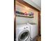 Convenient laundry room with a washer, dryer, and storage shelves at 22569 State Road 37 N, Noblesville, IN 46060