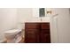 Bathroom featuring tile floors, a modern toilet, a brown vanity and a mirror at 2332 Brightwell Pl, Indianapolis, IN 46260